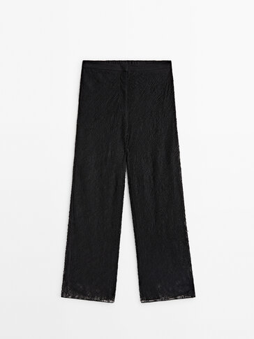Black trousers with rhinestone detail