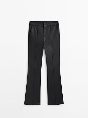 Waxed kick flare trousers with central seam