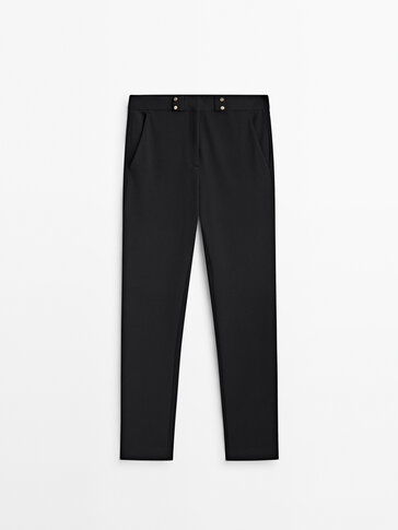 Stretch trousers with golden buttons