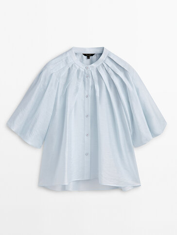 Pleated shirt with short puff sleeves