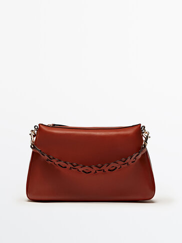 Leather shoulder bag with interwoven strap