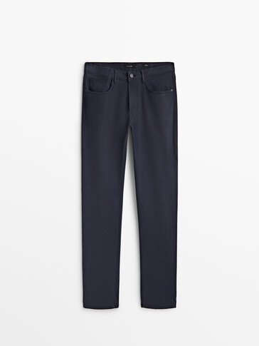 Tapered fit textured denim trousers