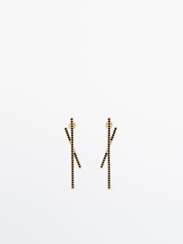 Gold-plated asymmetric earrings with black stones