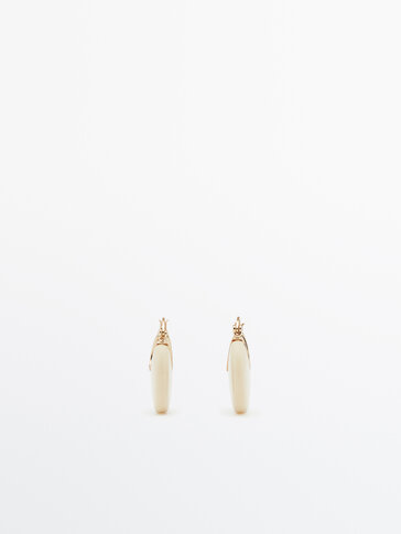Gold-plated white resin earrings