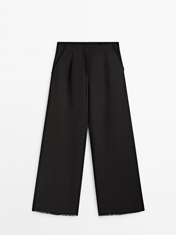 Black darted frayed trousers