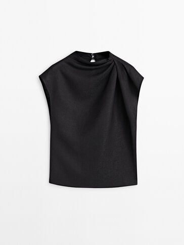 Top with draped shoulders
