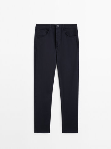 Pantaloni tipo denim in tricotine tapered fit