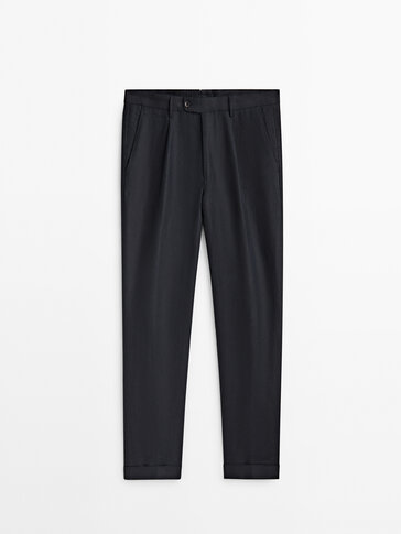 Lniane spodnie z zakładkami o kroju relax fit − Limited Edition