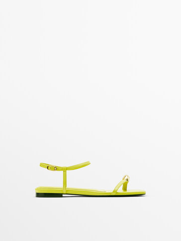 Leather flat slider sandals with metallic piece