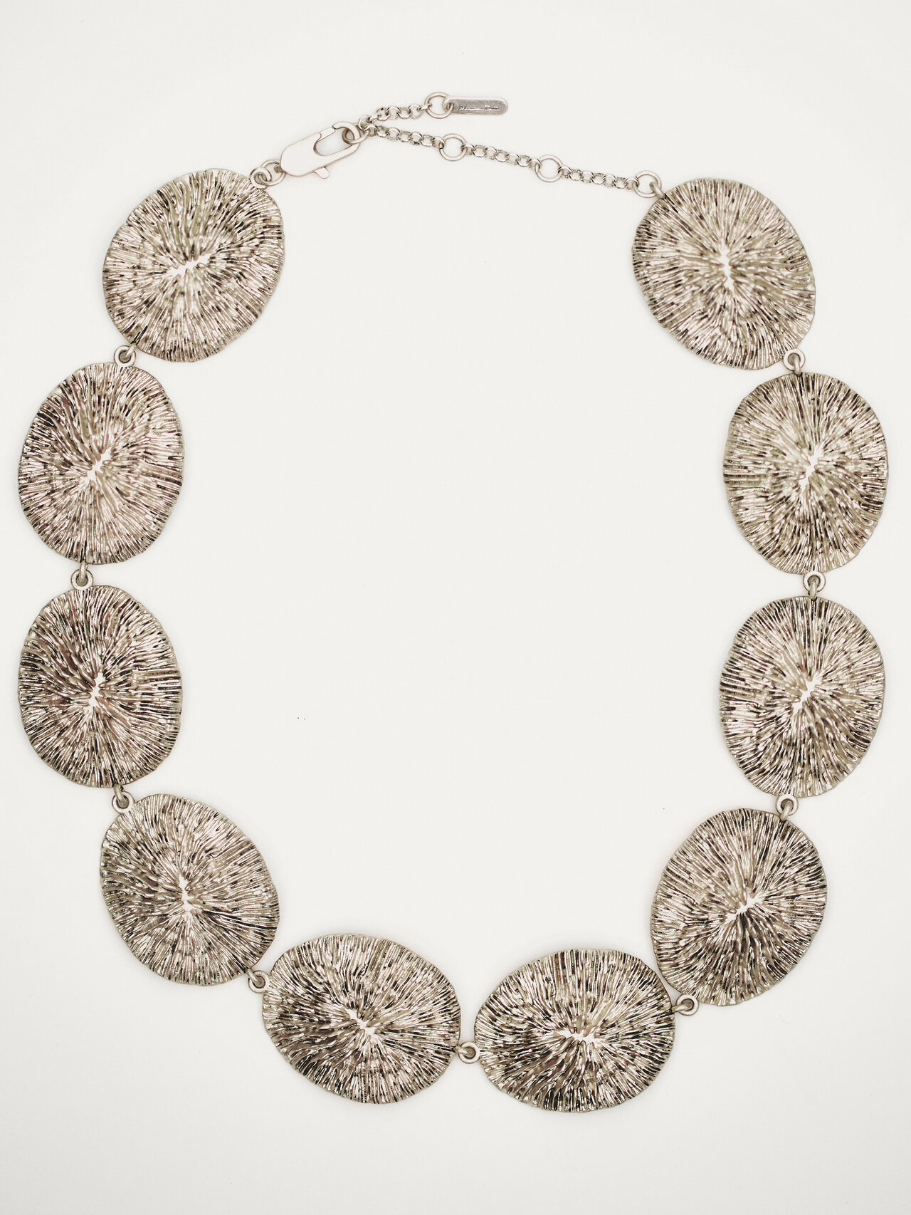 Necklace with oval textured pieces