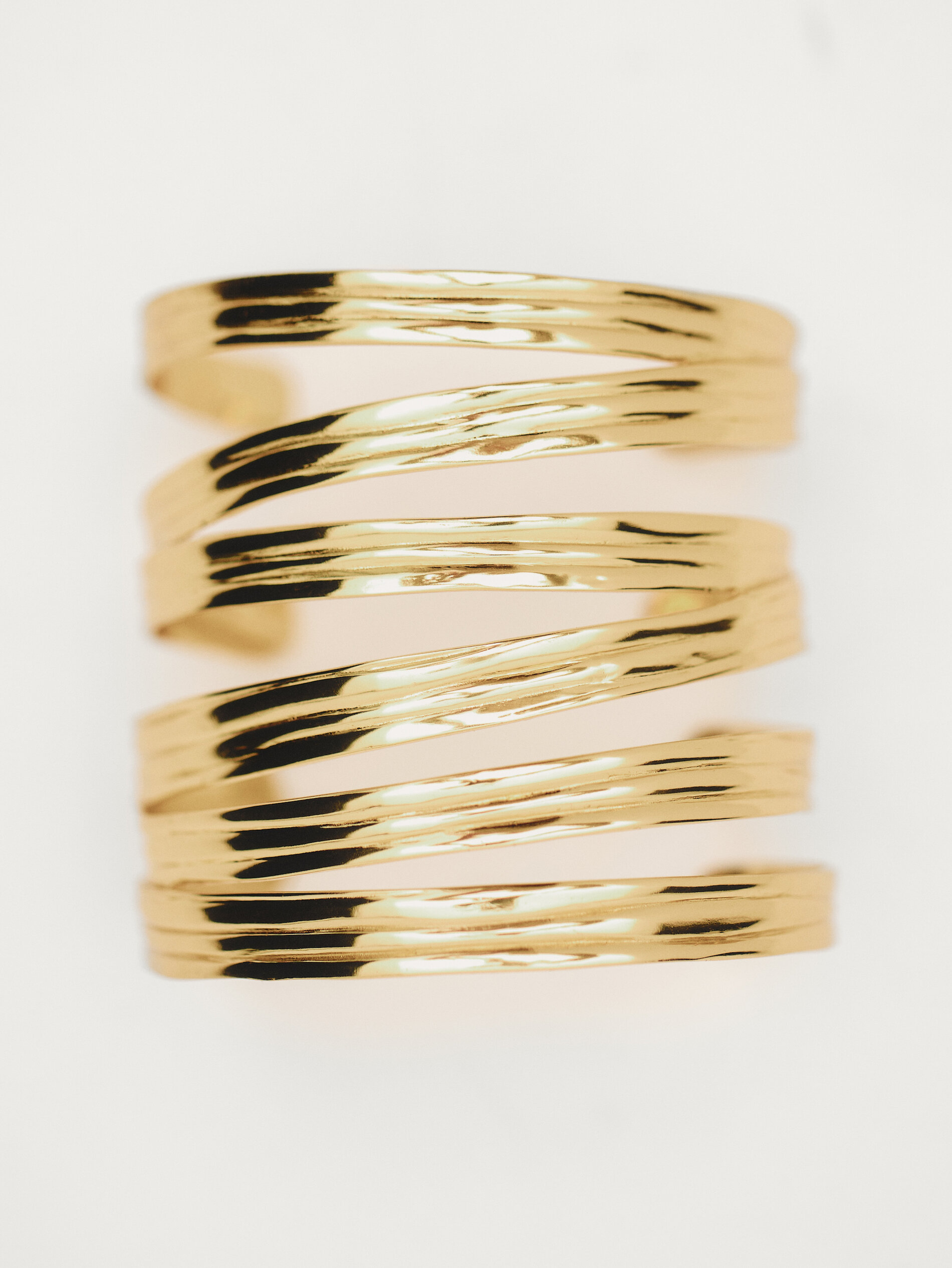 Wide rigid multi strap arm cuff