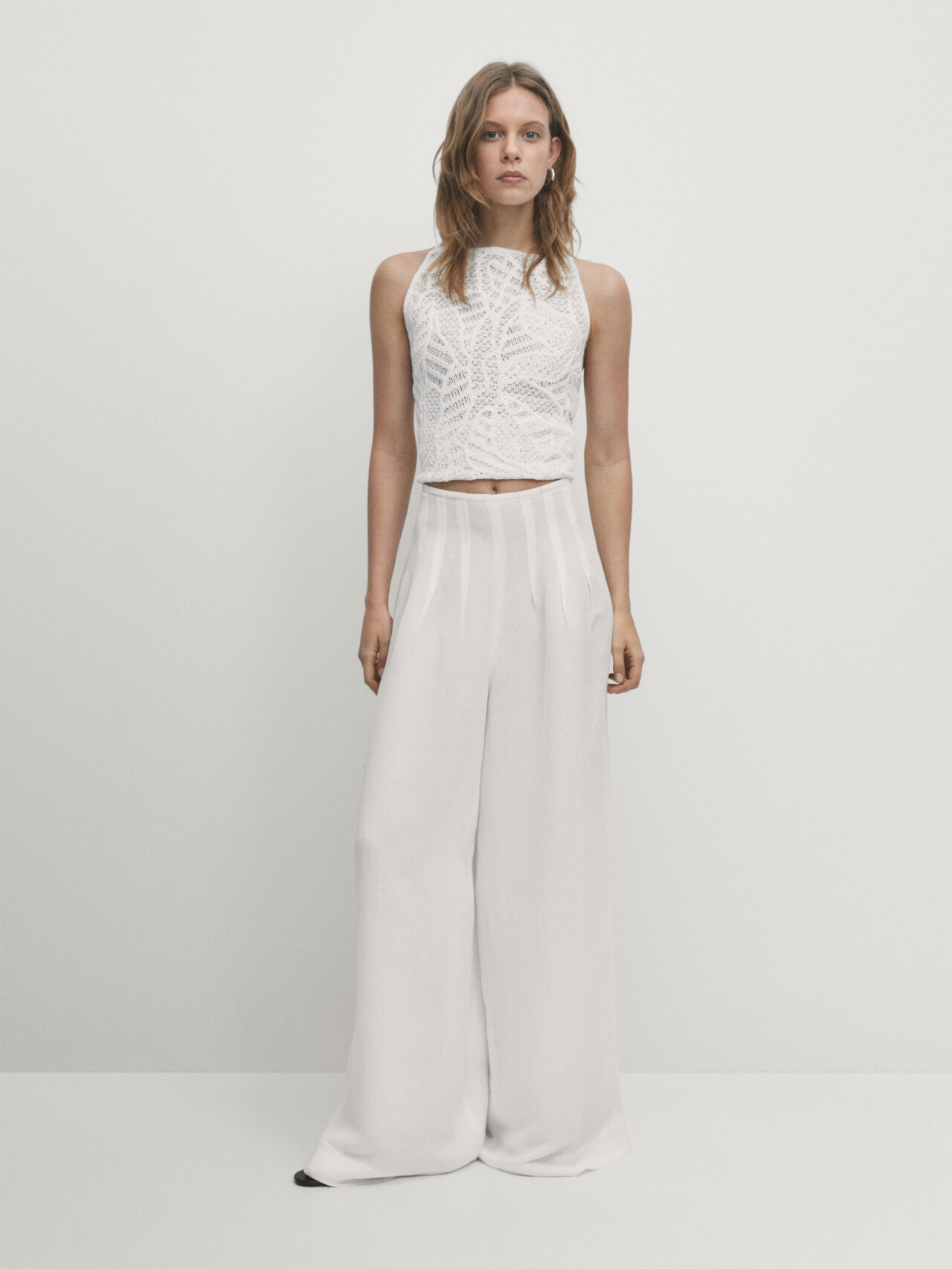 Wide-leg trousers with pleated details