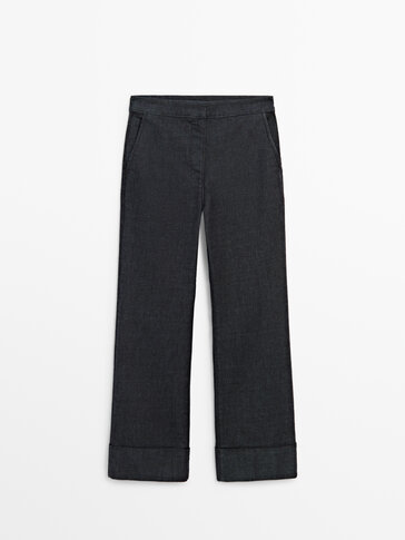 High-waist flared fit jeans with turn-up hems