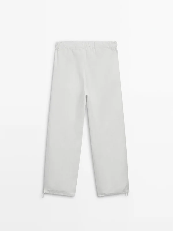 Trousers with elastic waistband and adjustable hem · White · Dressy ...