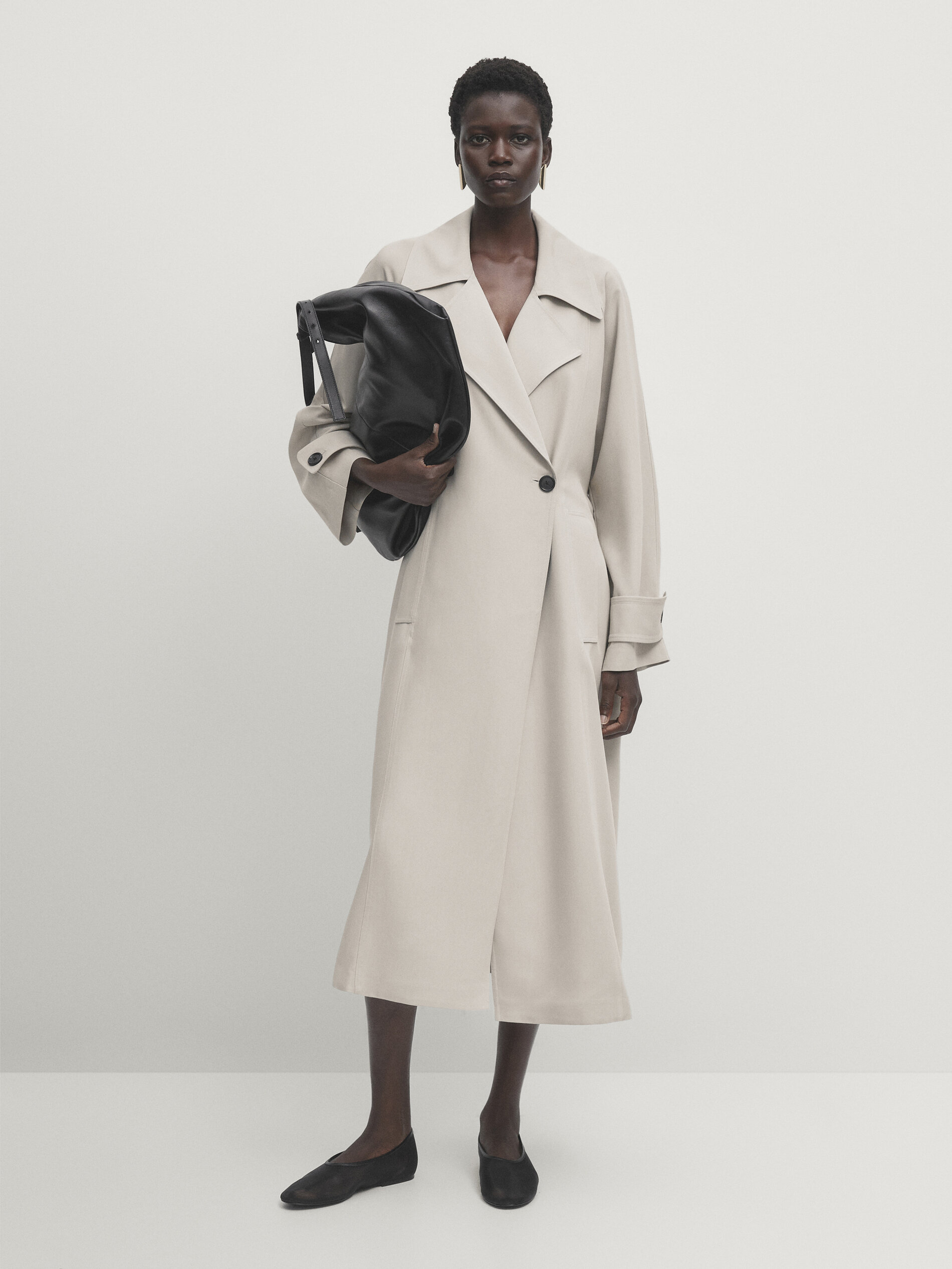 Loose-fitting trench coat with belt · Cream · Coats And