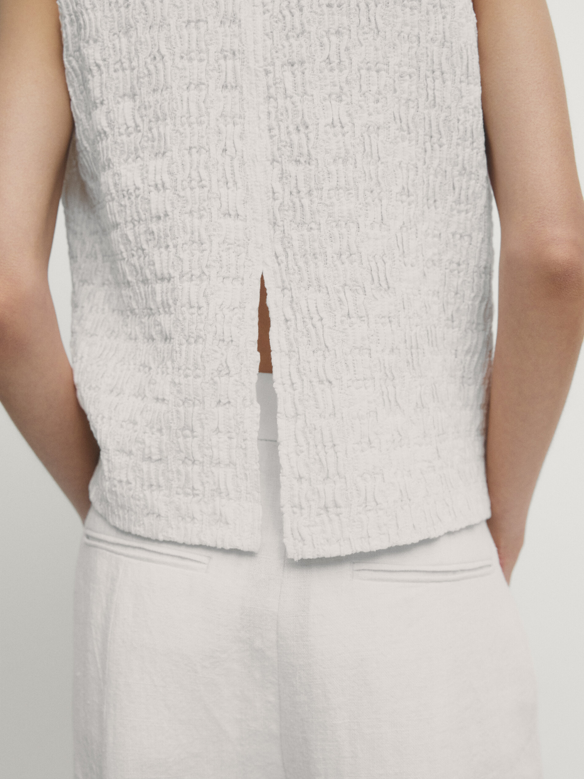 Sleeveless top with vent detail