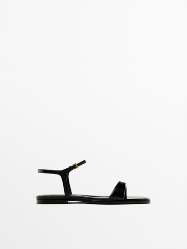 Flat creased patent finish sandals
