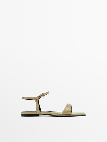 Flat creased patent finish sandals