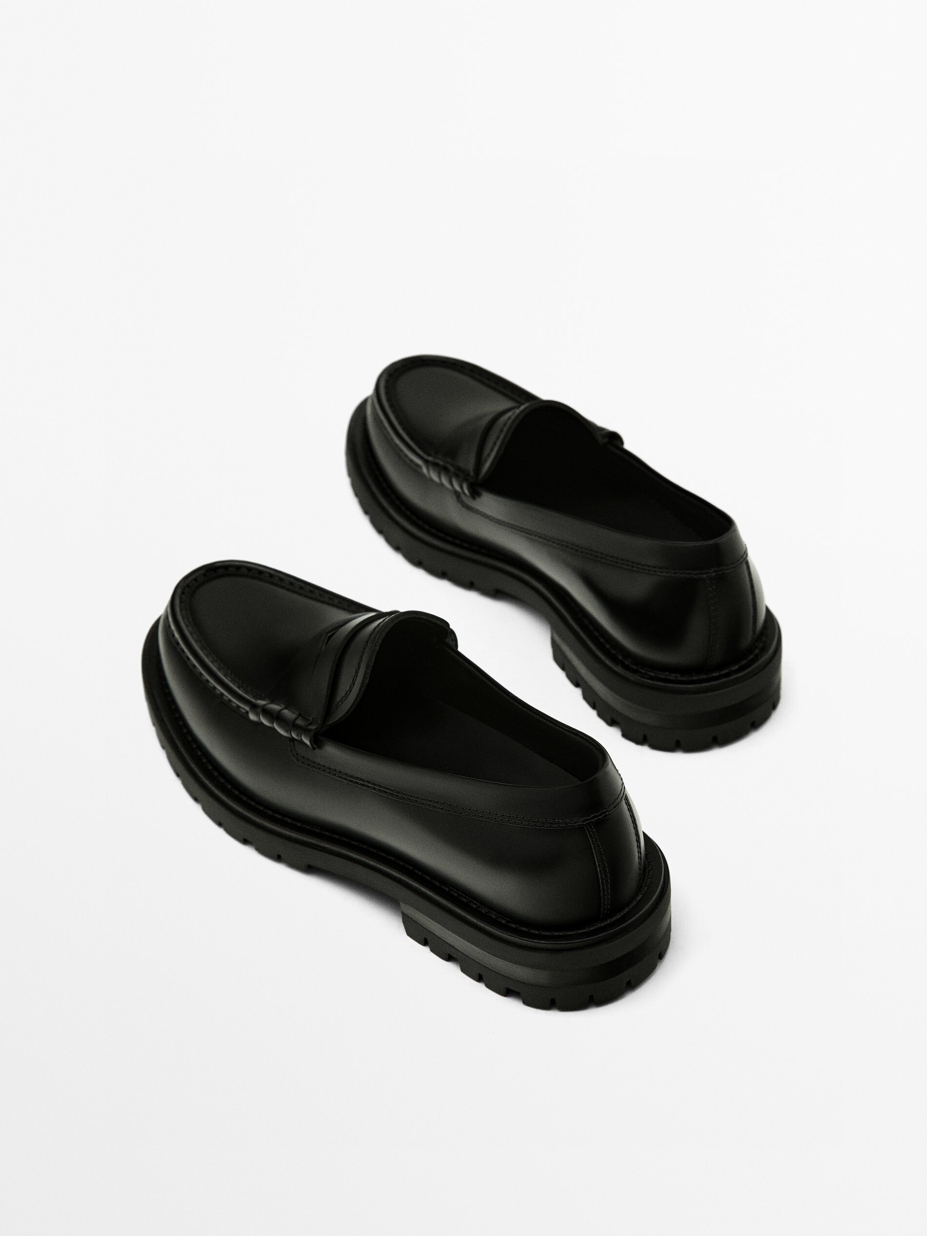 Black track sole loafers with penny strap