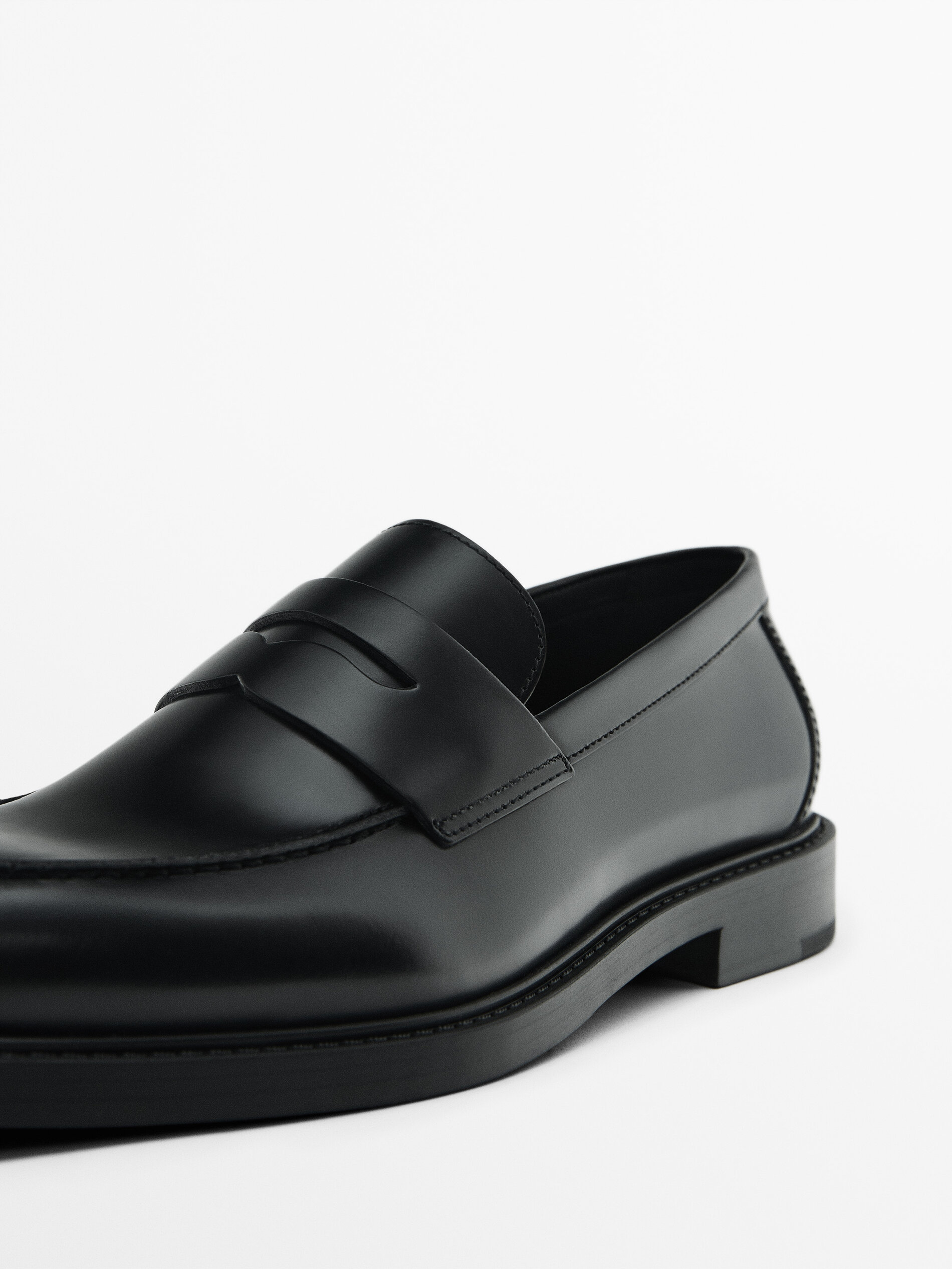 Black leather penny loafers