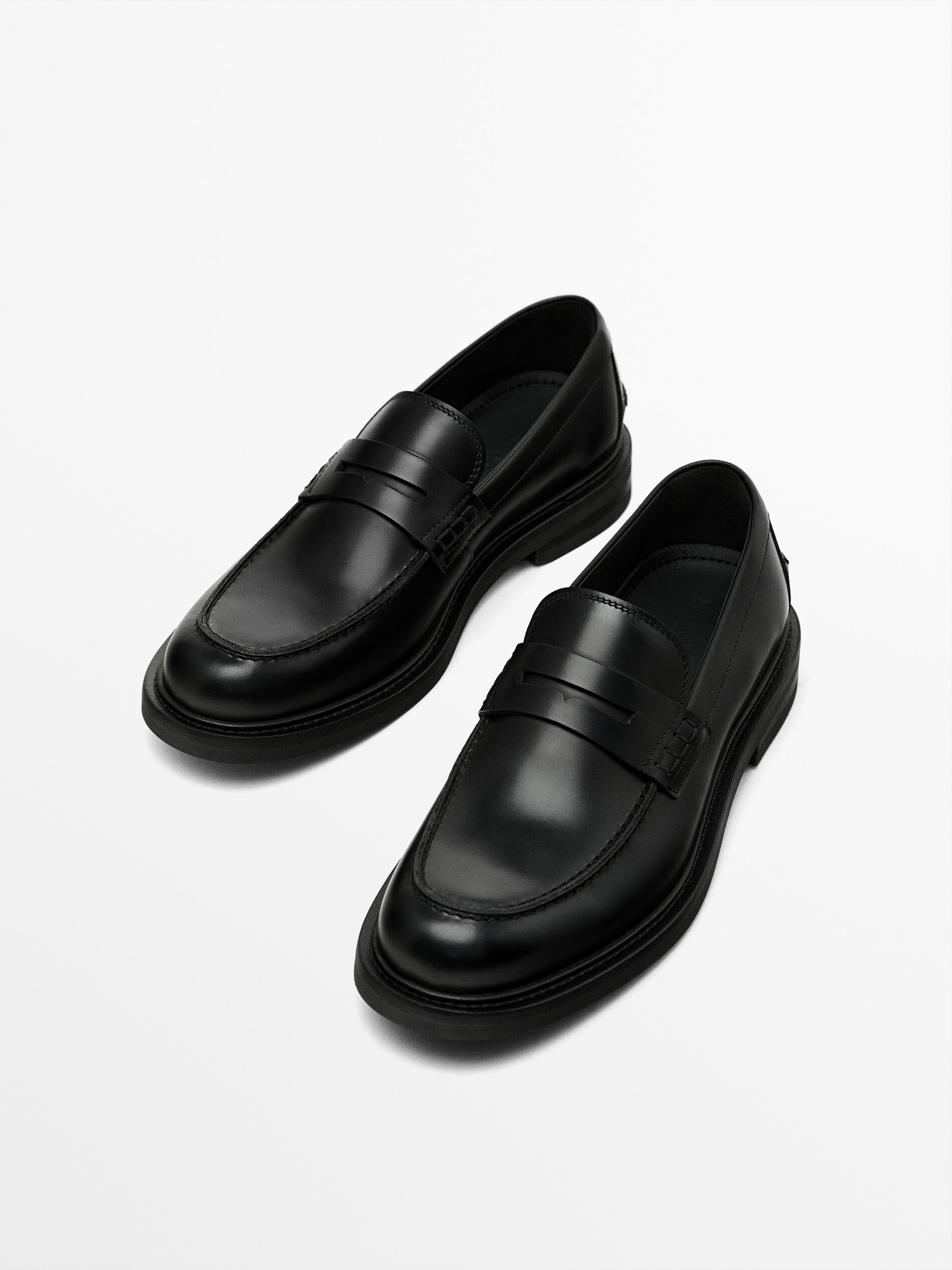 Black penny strap loafers