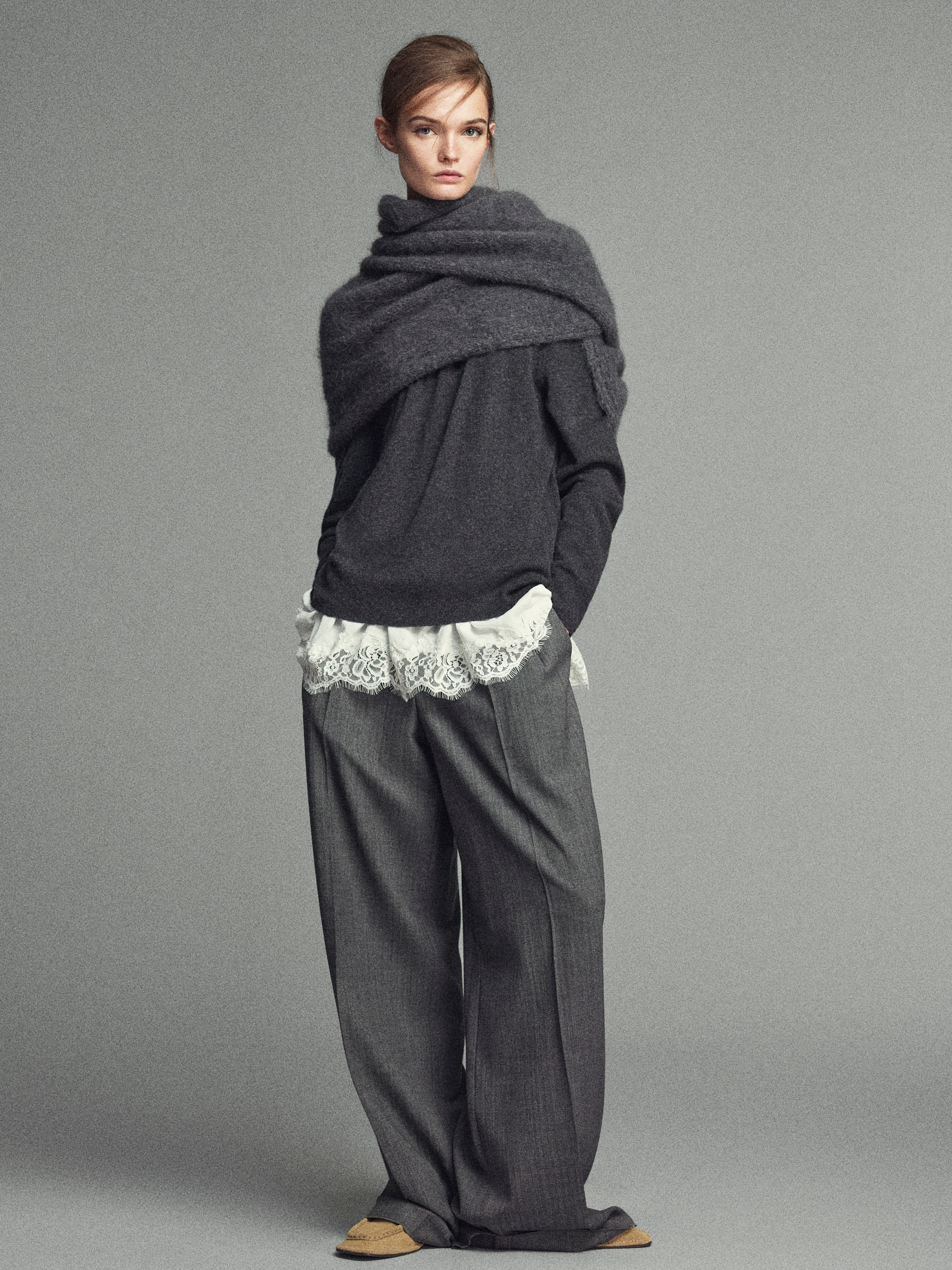 Knitted jumper with lace detail underneath