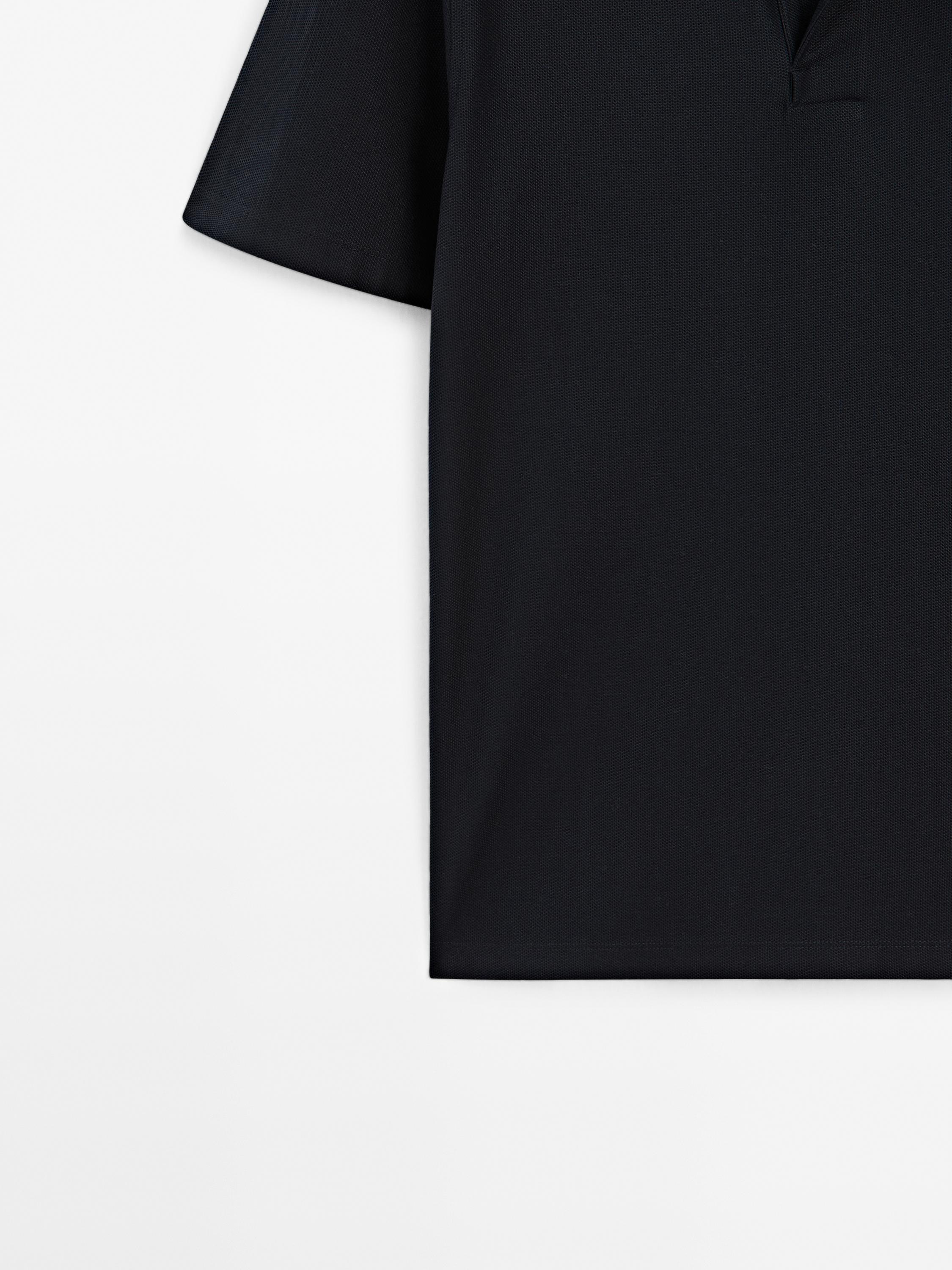 Textured polo shirt with hidden button