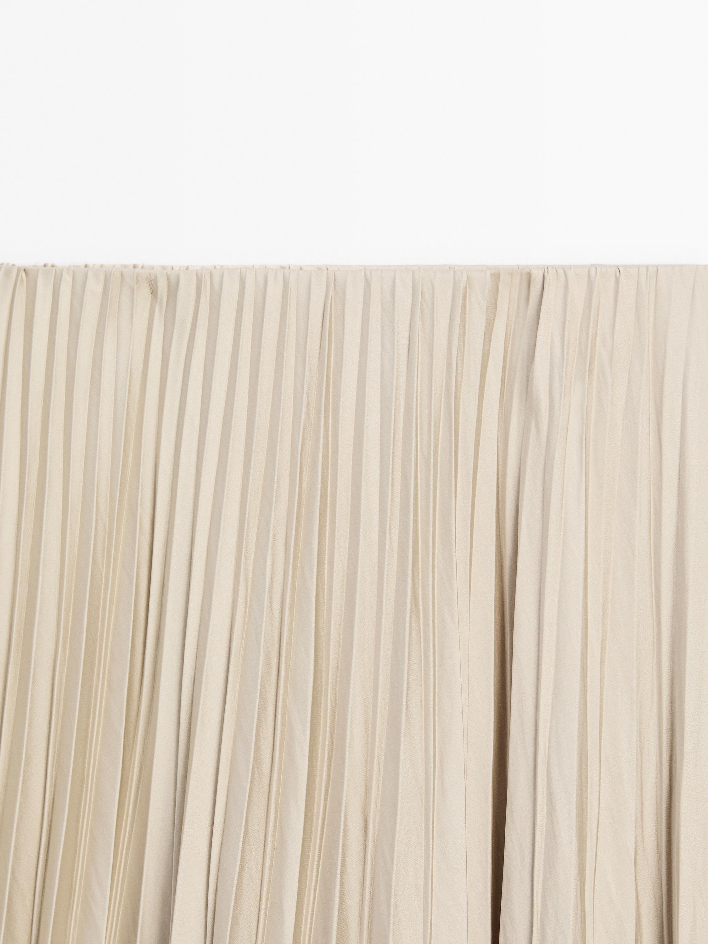 Flowing pleated satin skirt