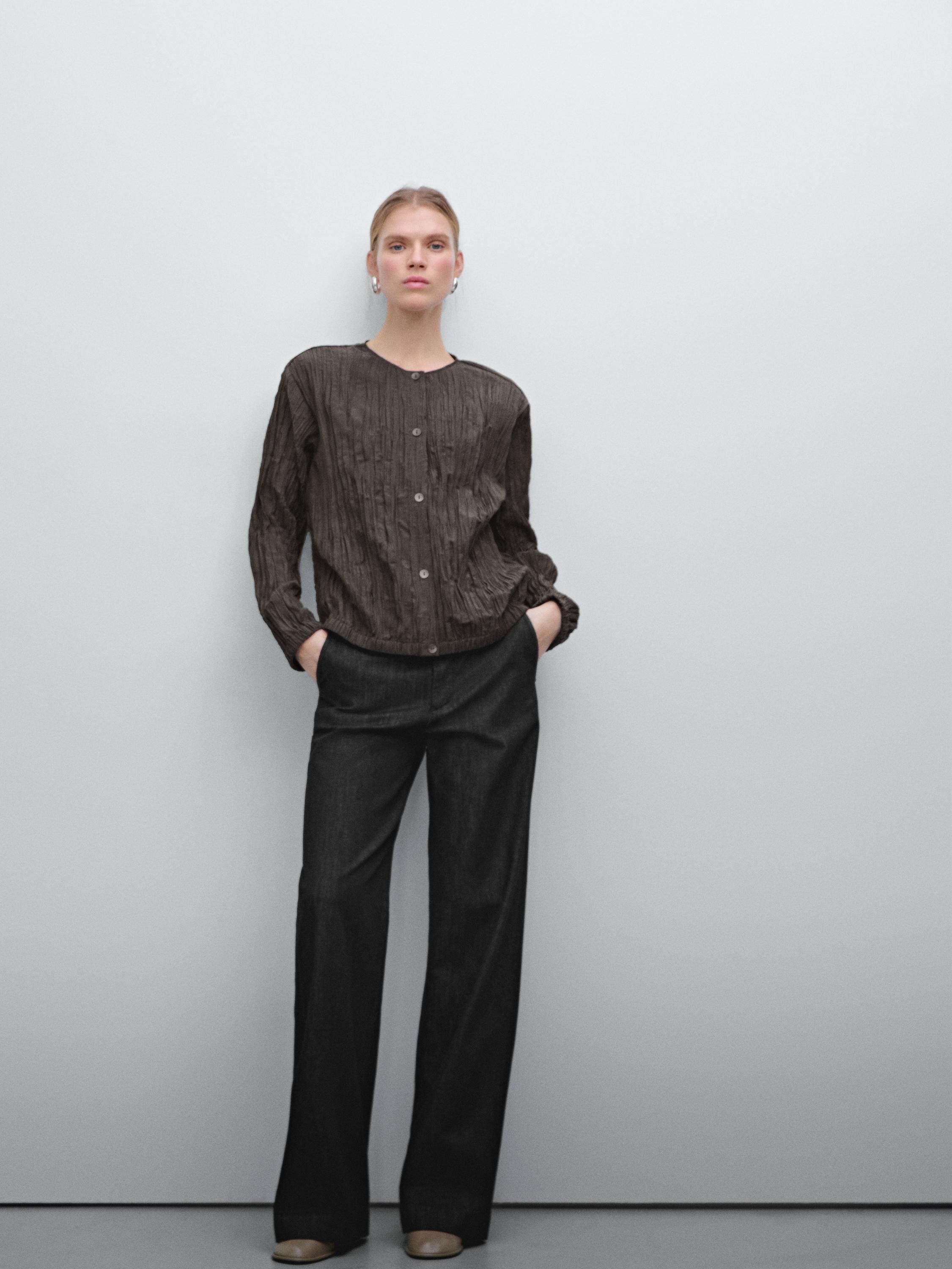 Flowing pleated bomber-style shirt