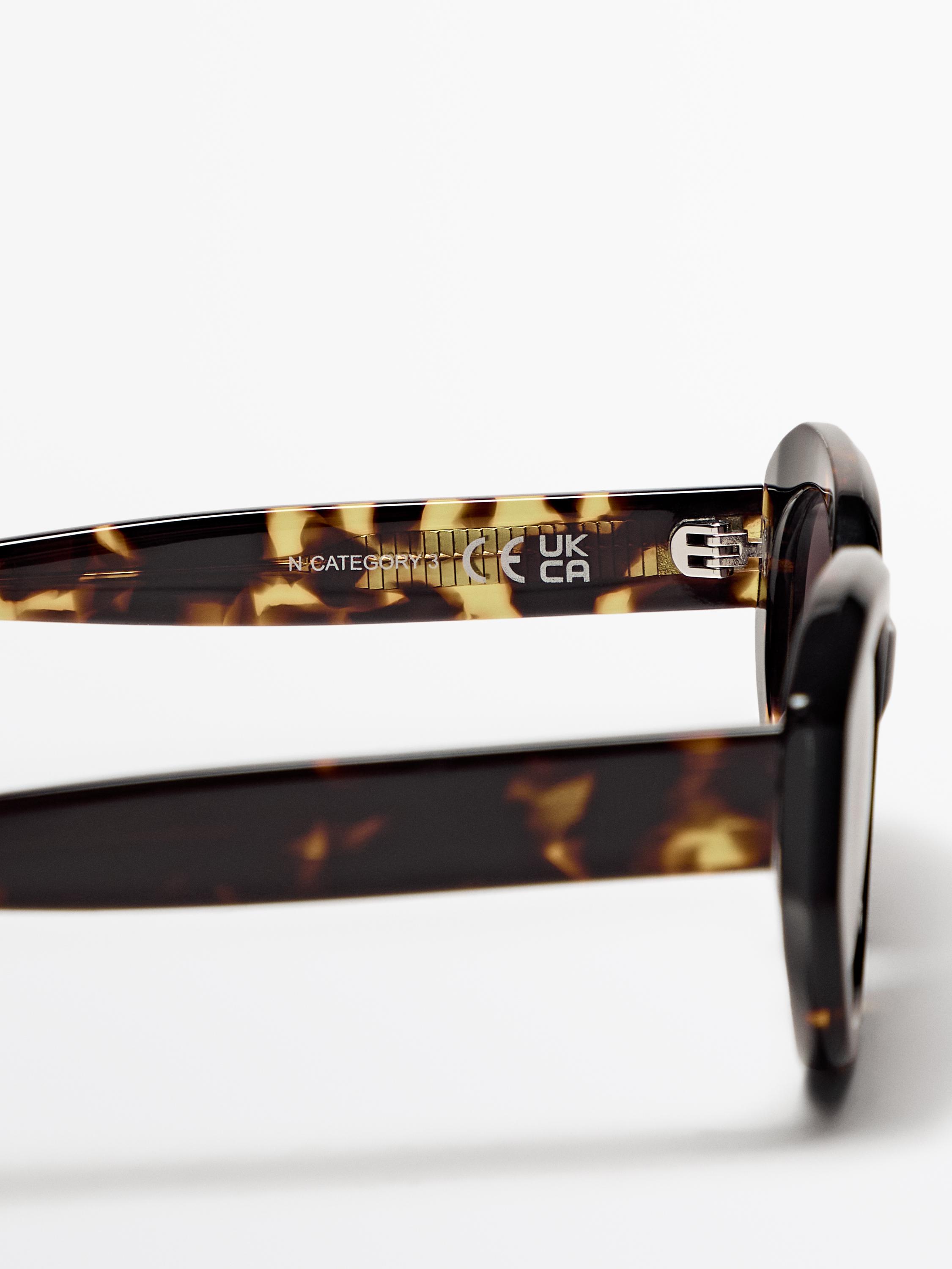 Oval tortoiseshell-effect sunglasses