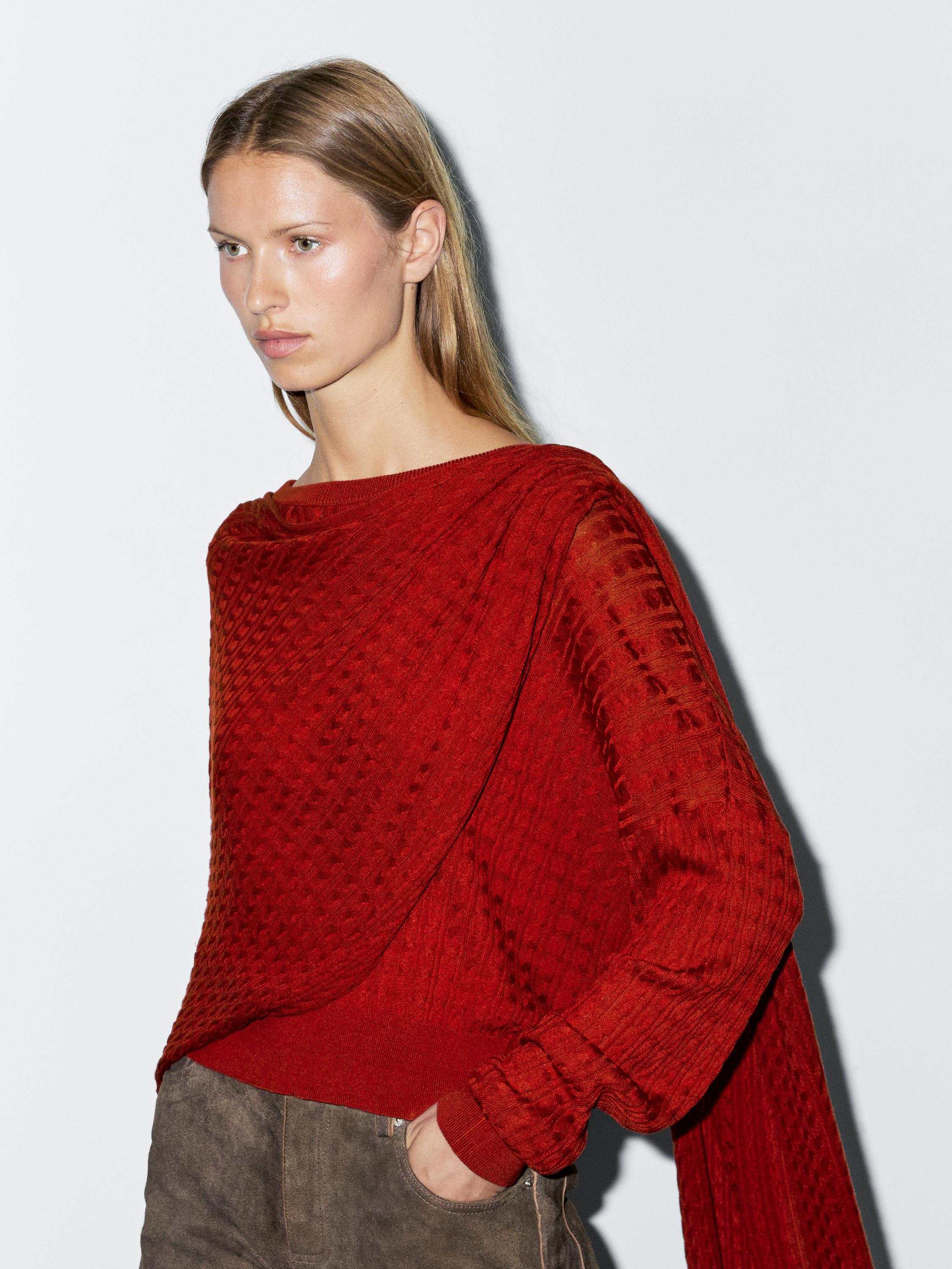 Cable-knit sweater with scarf detail