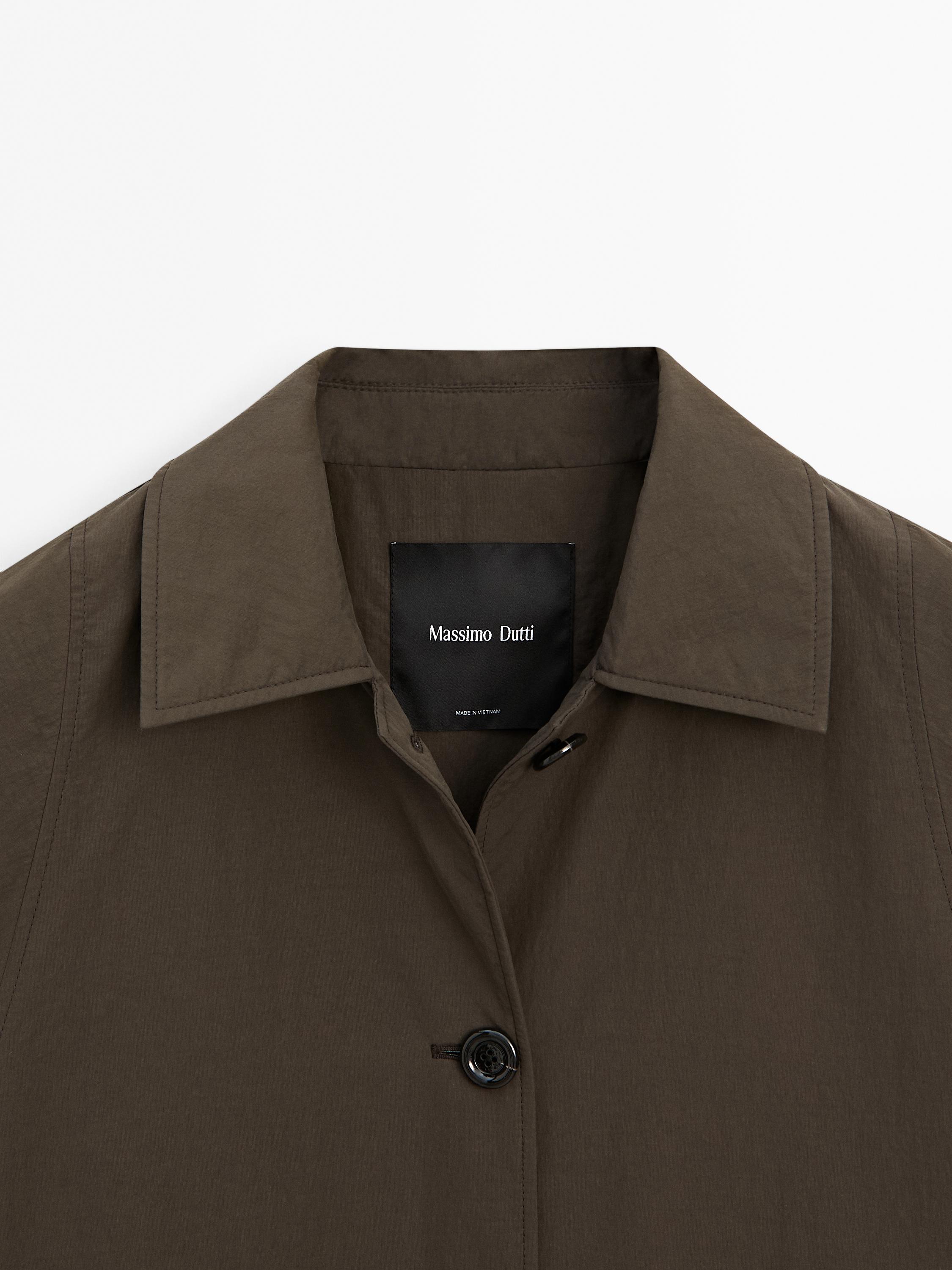 Technical fabric trench coat with button detail
