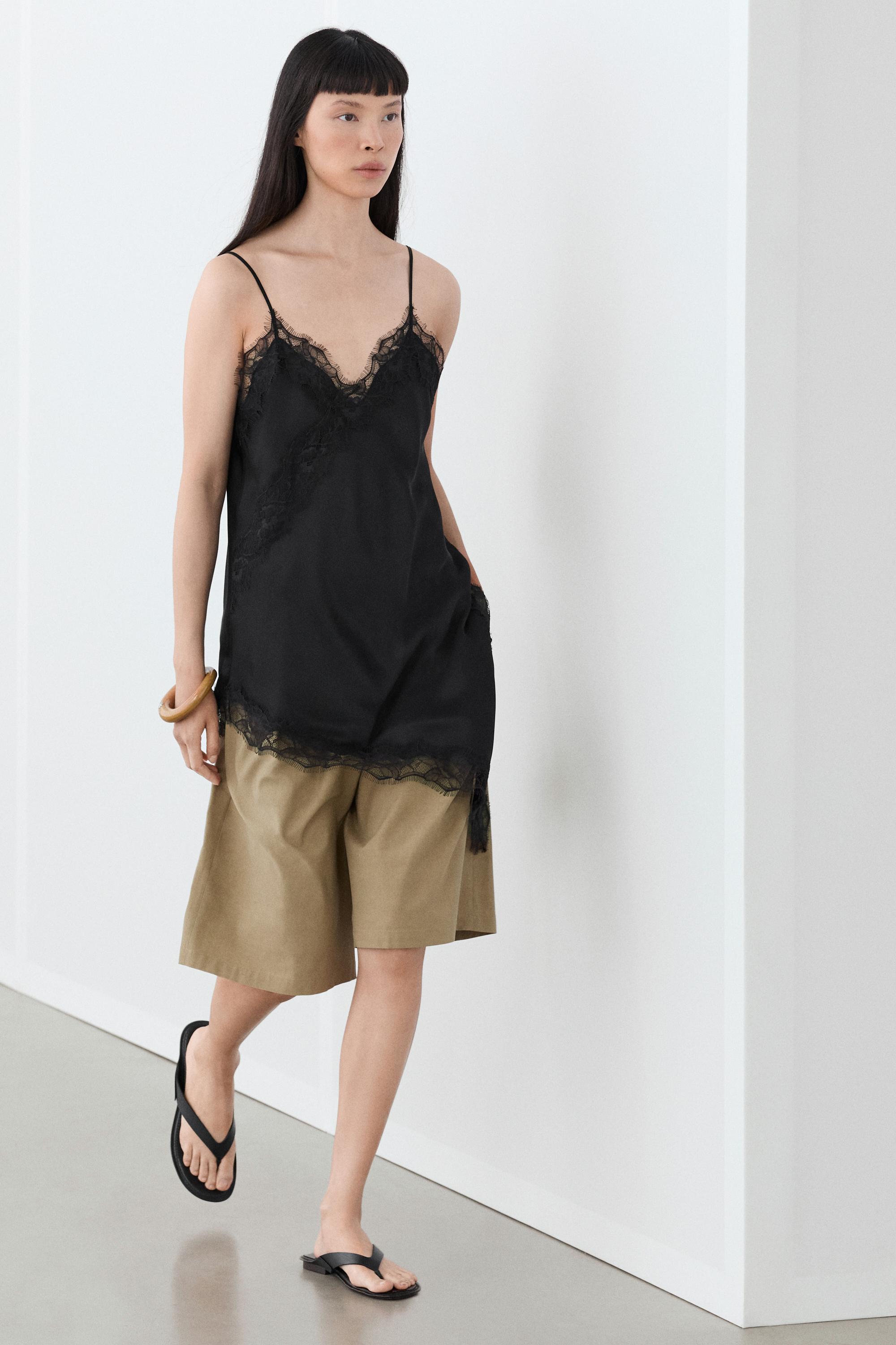 Asymmetric thin strap camisole top — BLACK