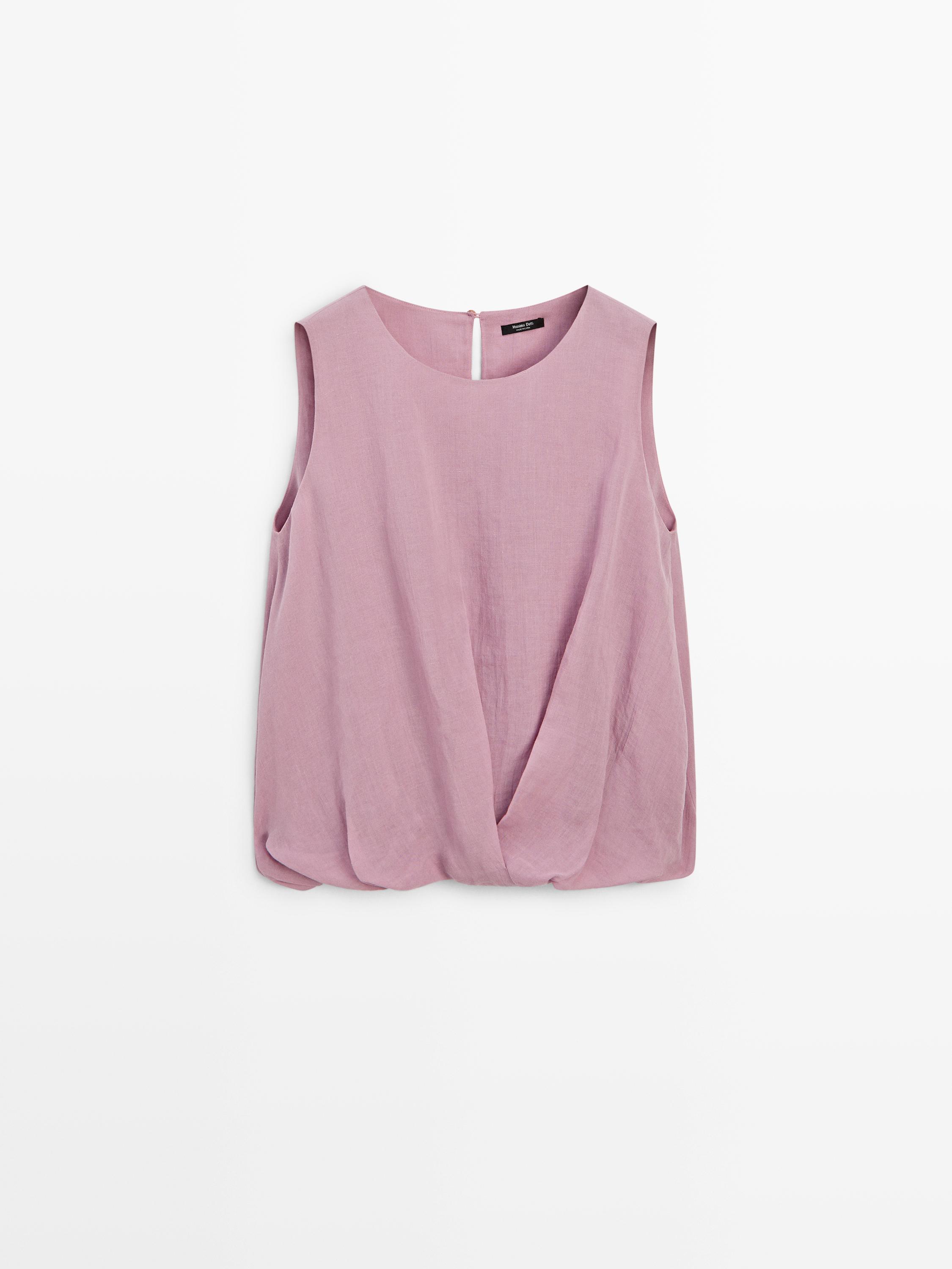 Front view of a pink sleeveless top with a round neckline and pleat in the front.
