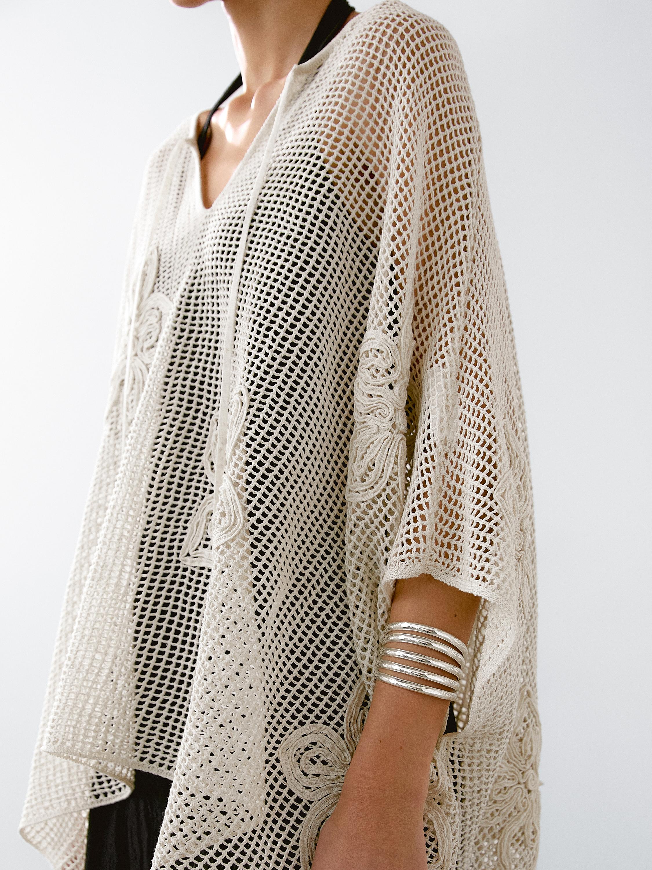 Embroidered cutwork cape