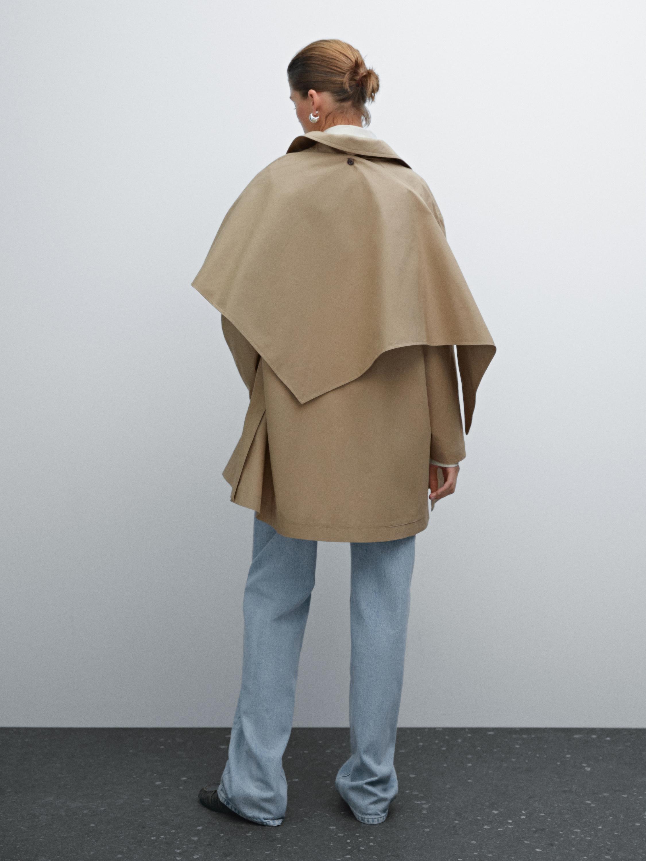 Trench coat with detachable scarf detail