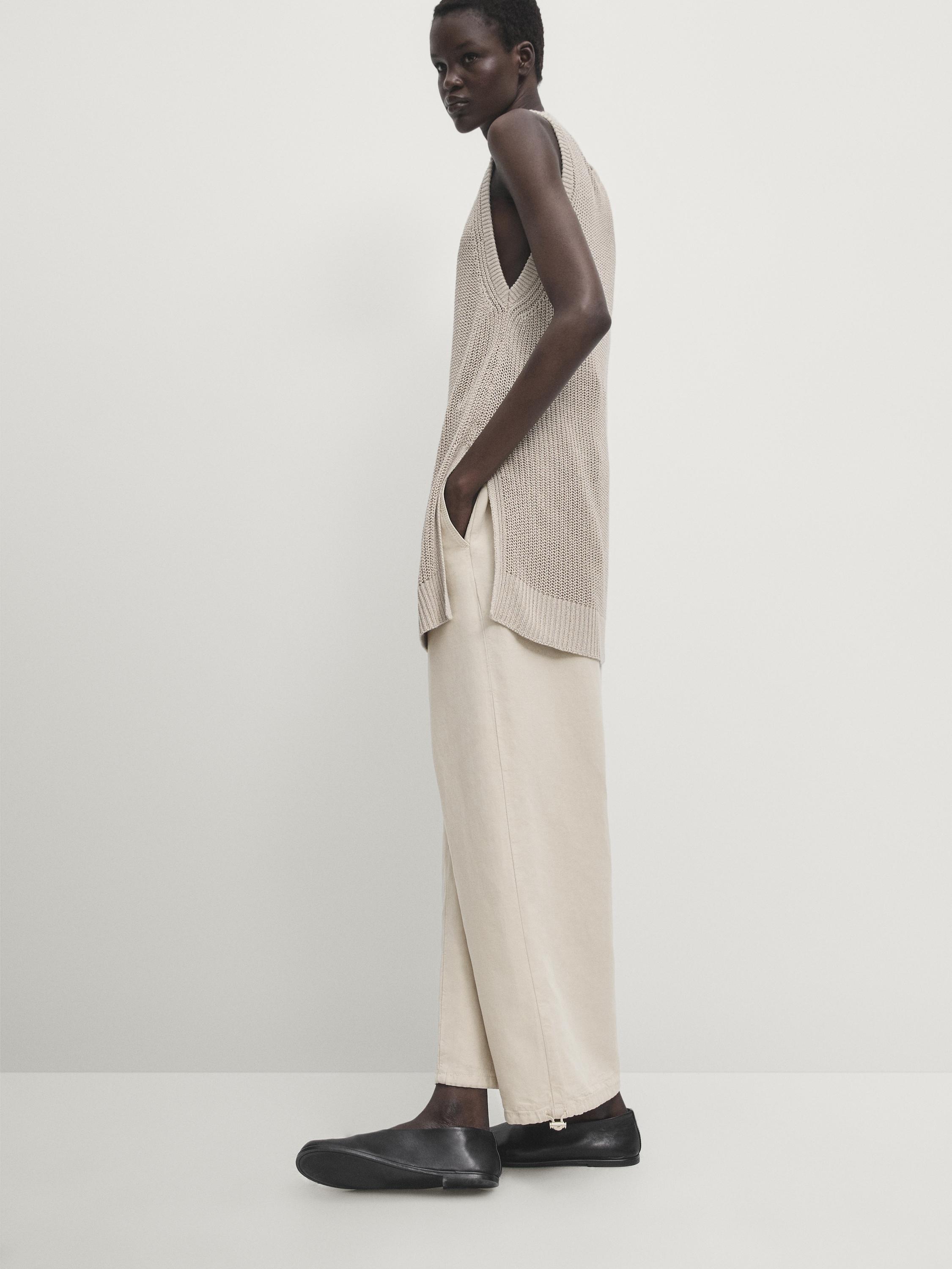 Trousers with elasticated waistband and adjustable hems