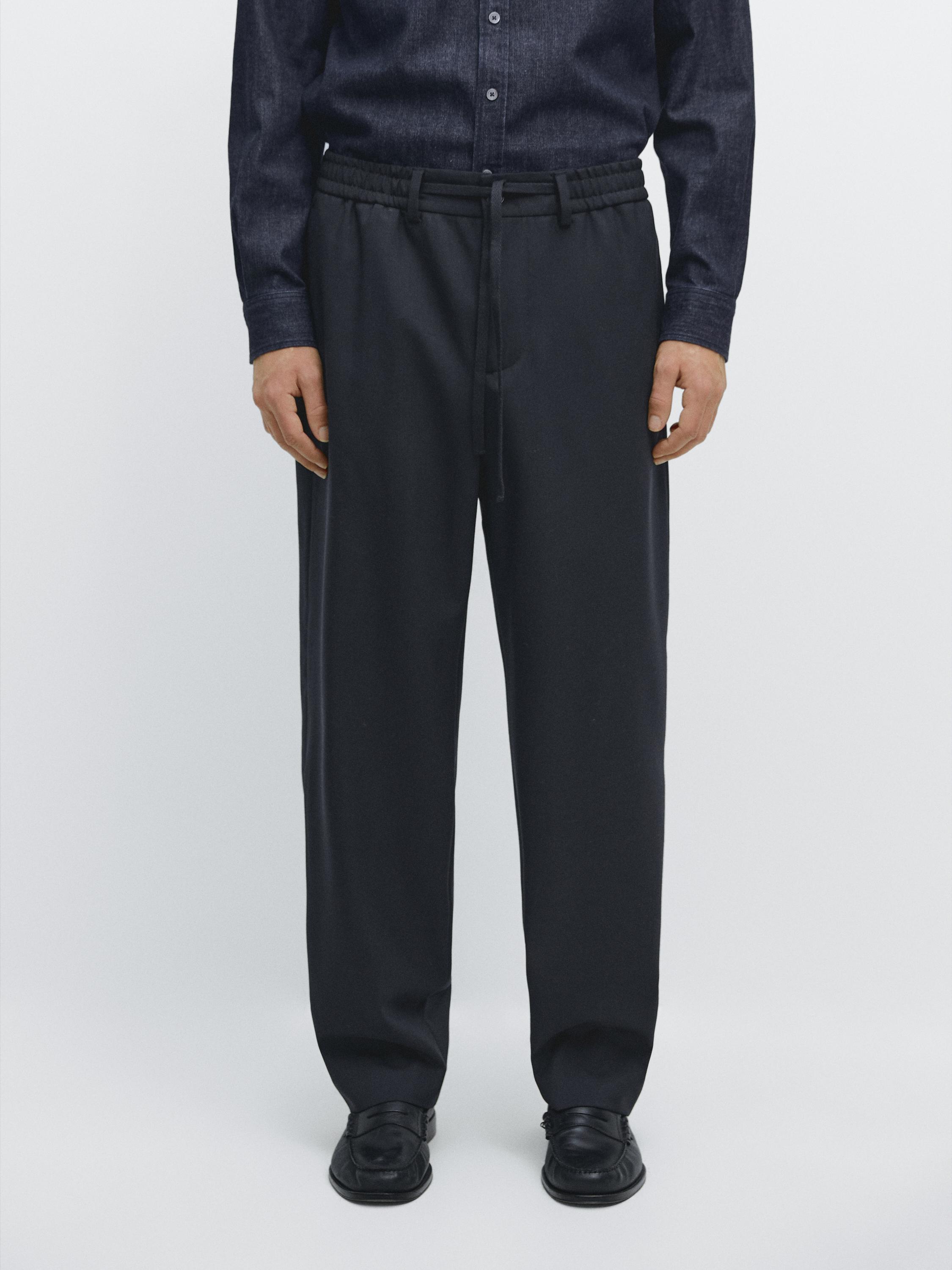 Dark blue shirt and navy blue pants set with elastic waistband and adjustable drawstring.