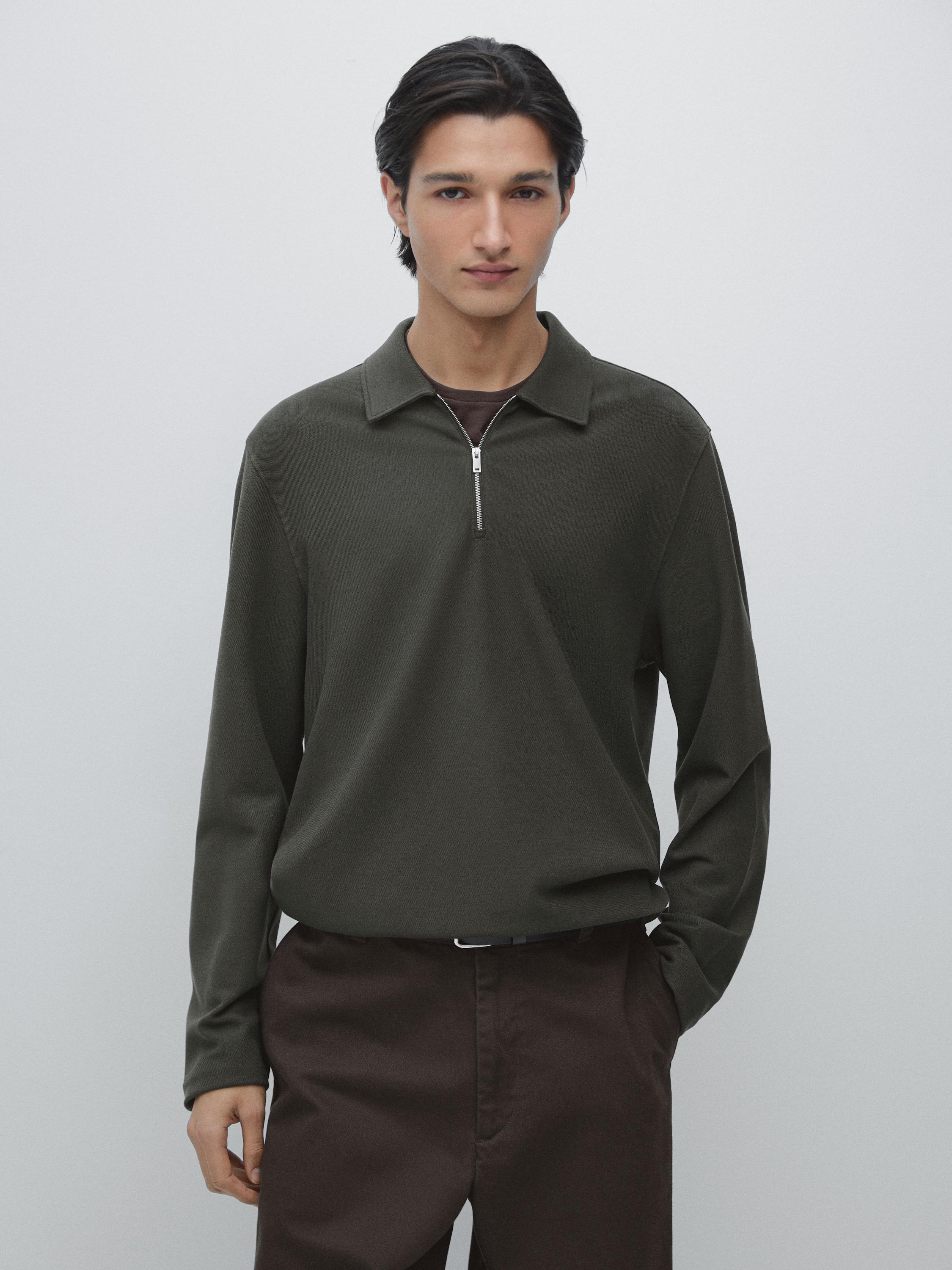 Dark khaki polo set with zipper and long sleeves, paired with brown pants.