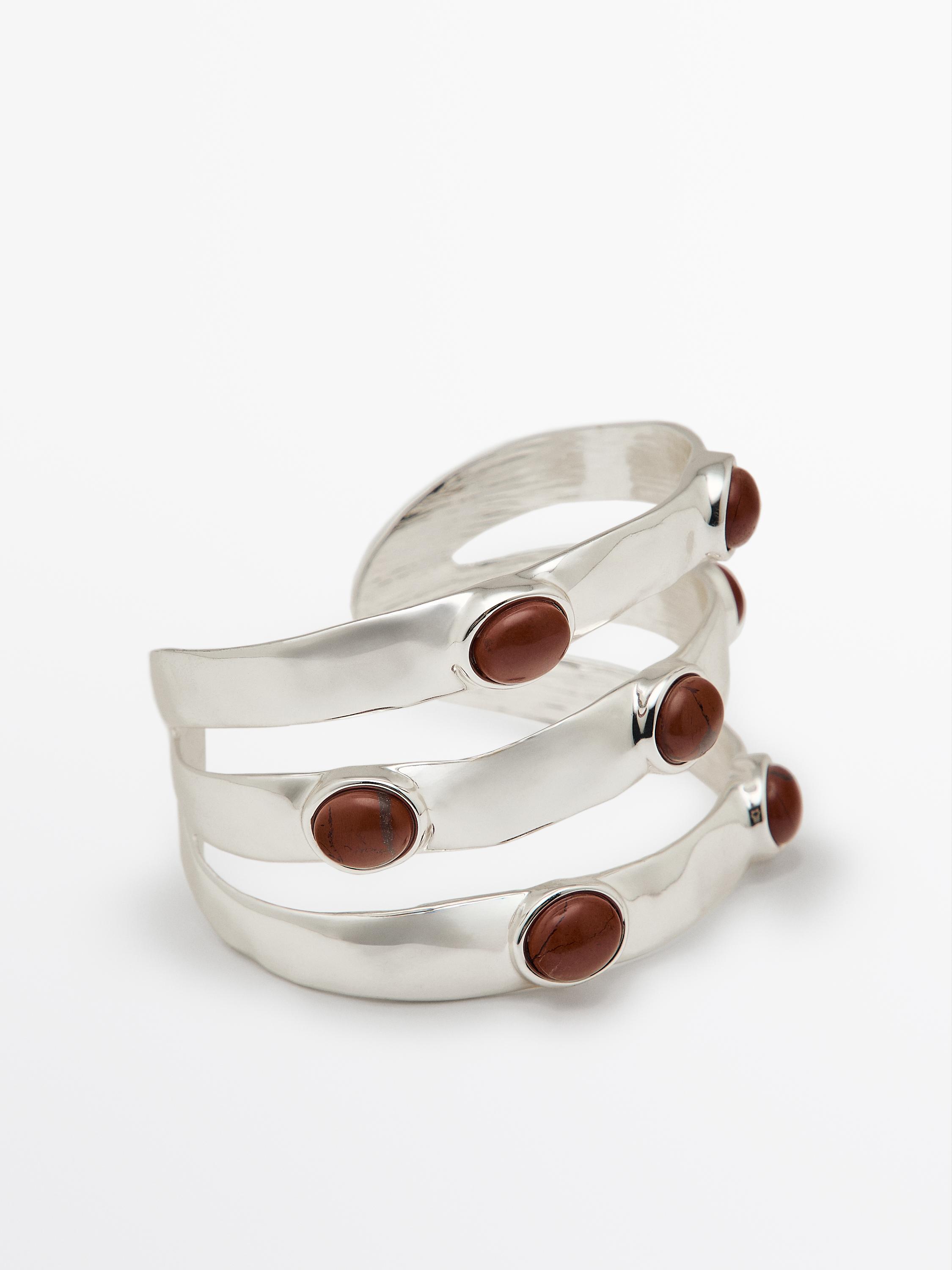 Wide bracelet with encrusted details