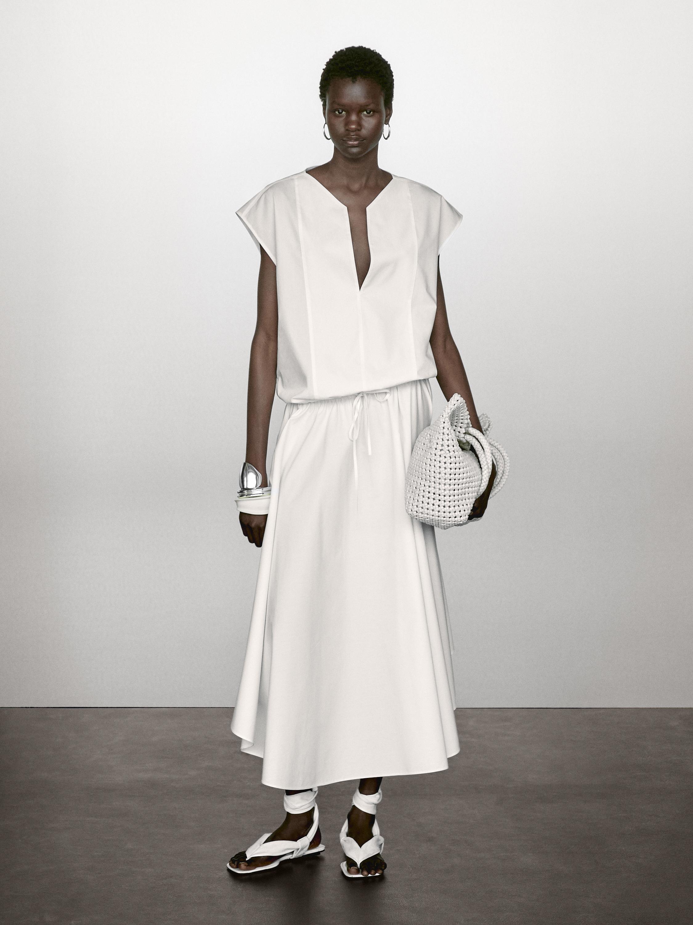 Blusa de popelina com pormenor de elástico em algodão