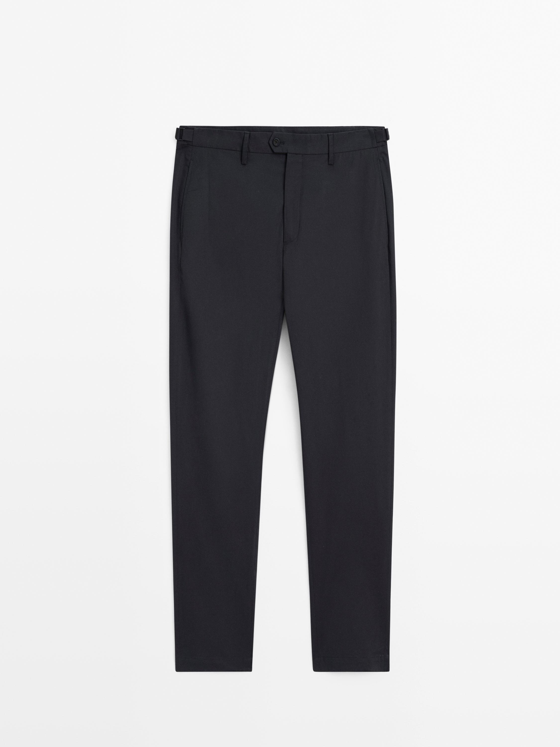 Tapered fit trousers buckle detail