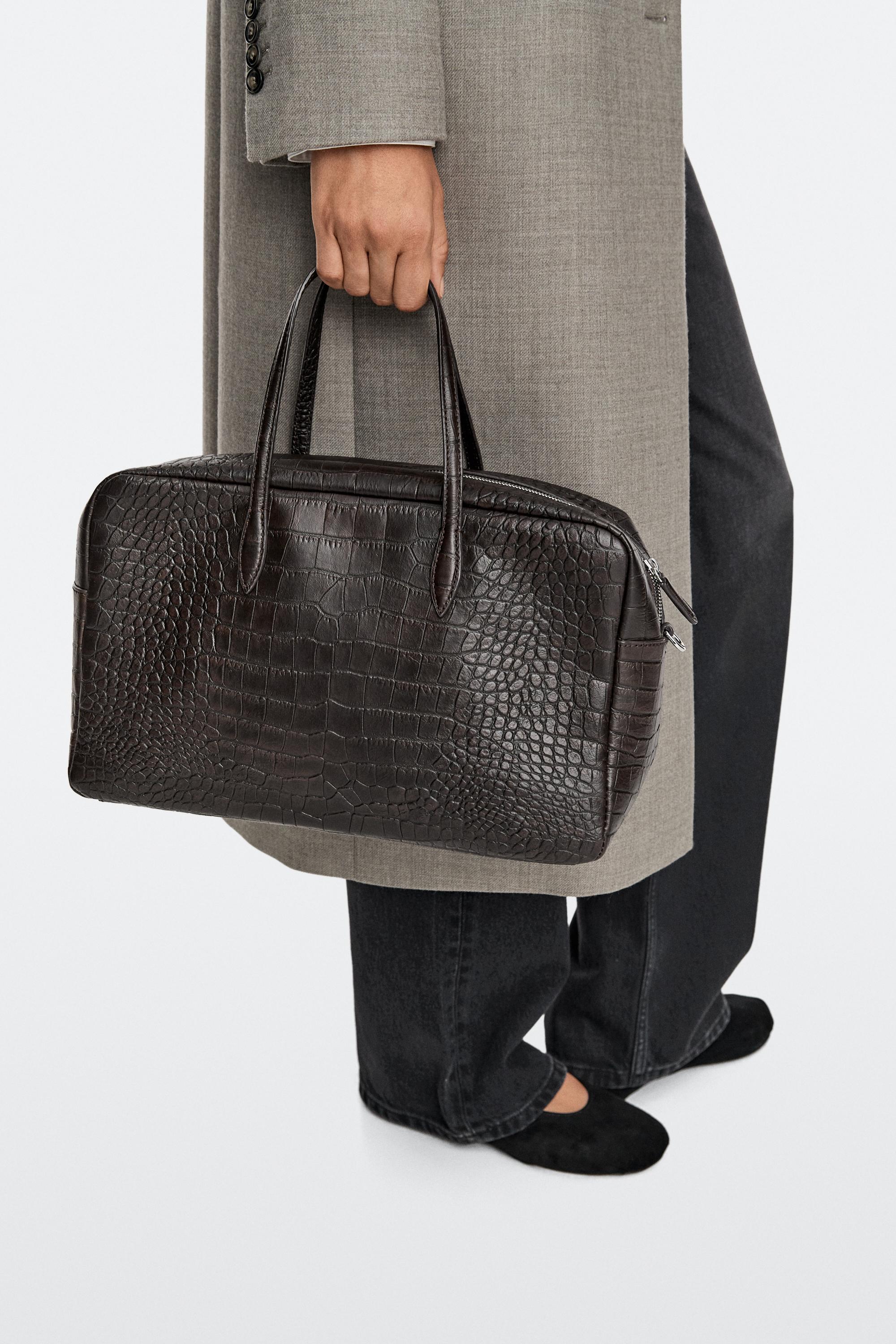 Medium leather textured duffle bag · Brown · Bagsâ Andâ Backpacks