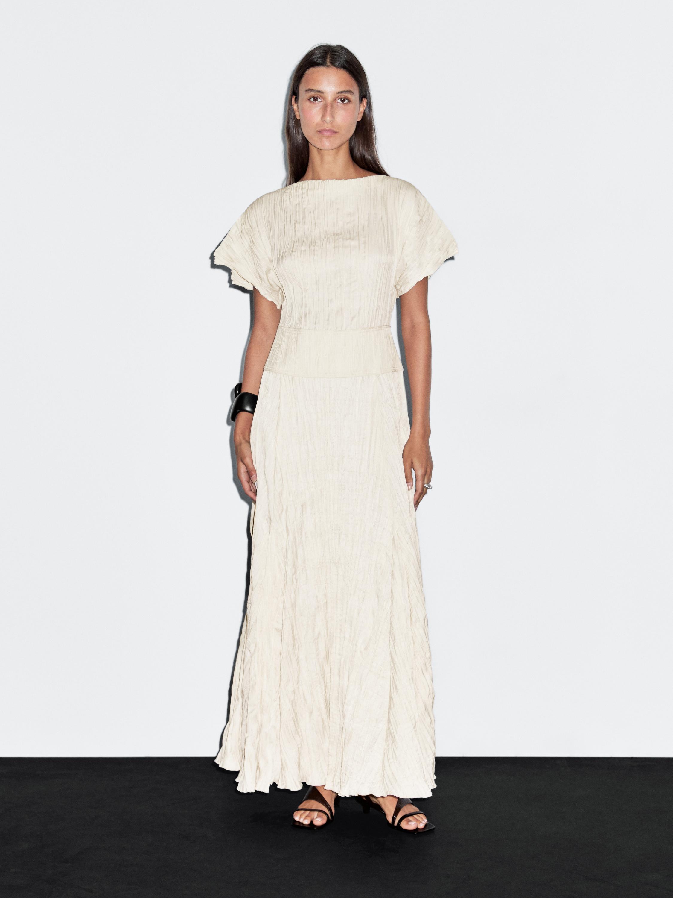 Long dress with godets and pleated detail
