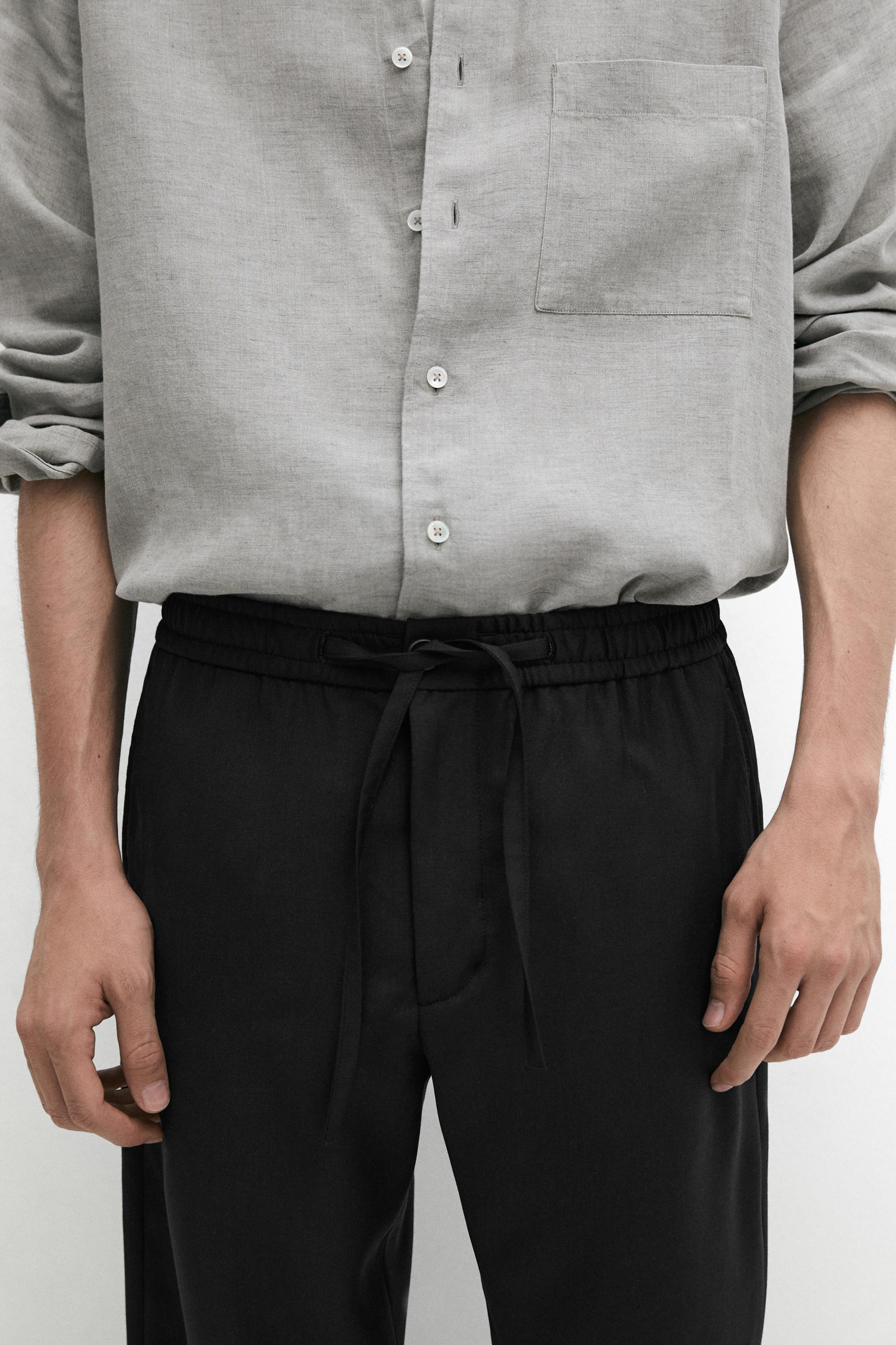 Relaxed fit 100% wool trousers — BLACK