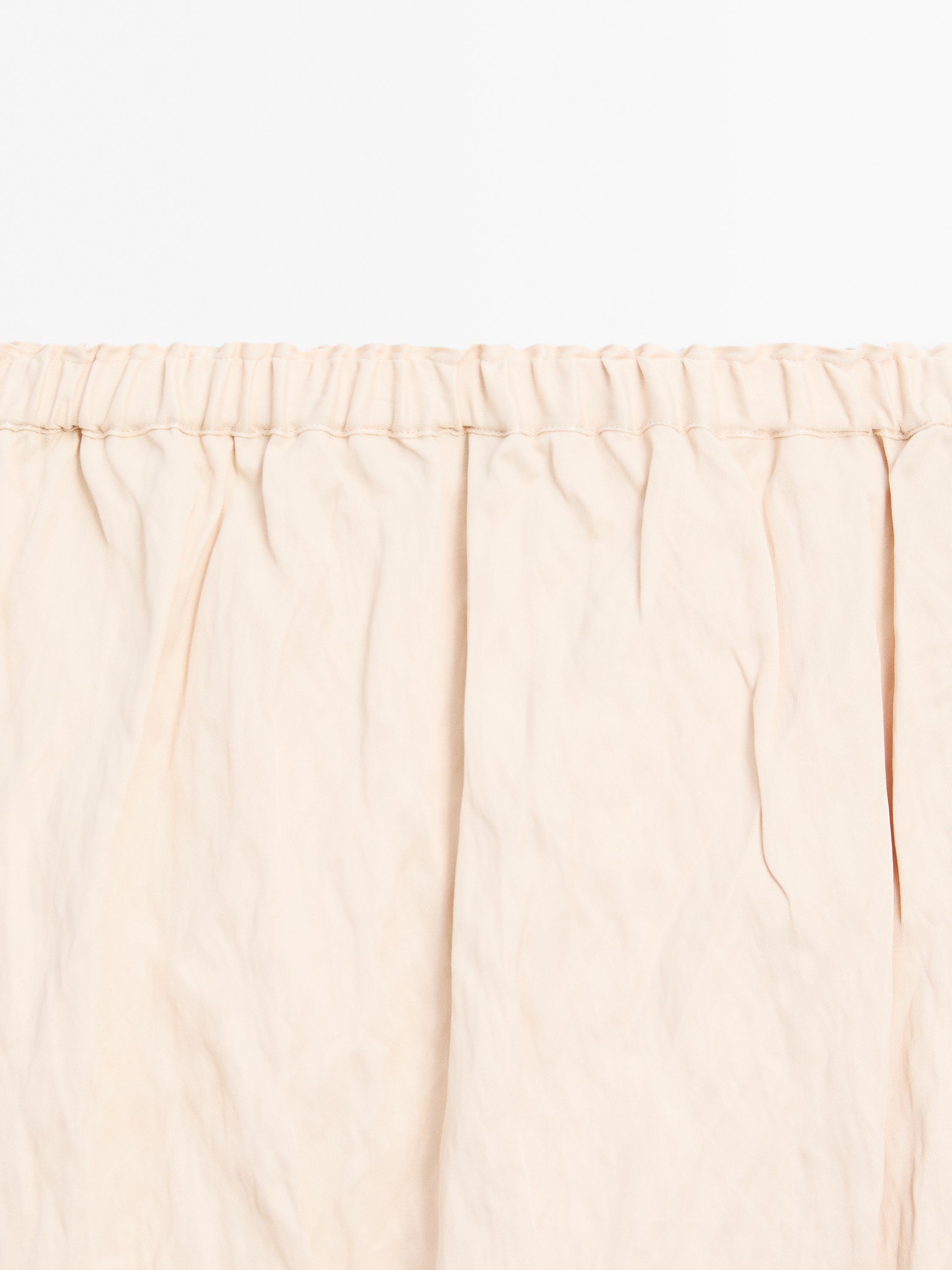 Flowing midi skirt with blonde lace detail