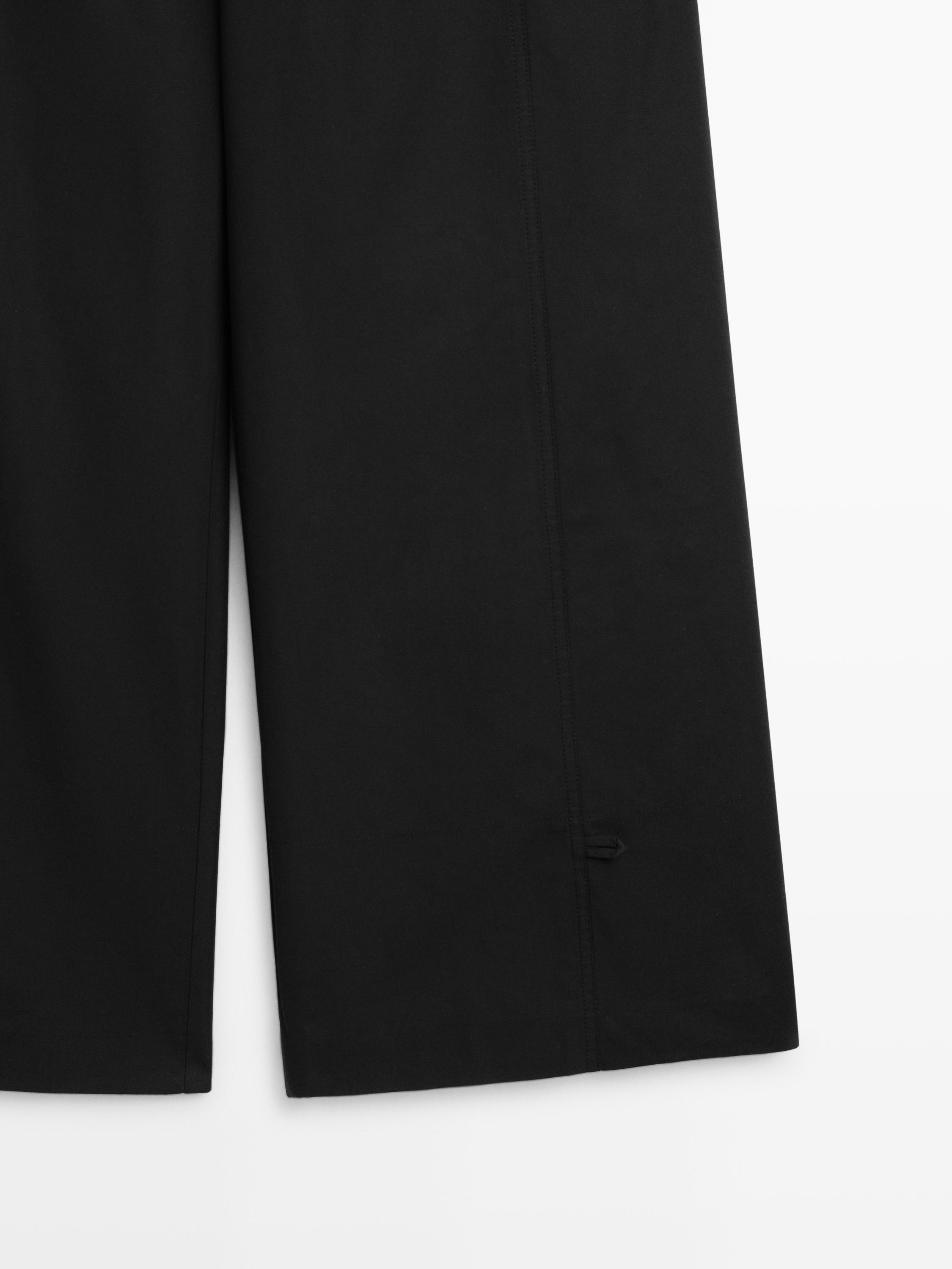 Cotton blend trousers with hem detail — BLACK