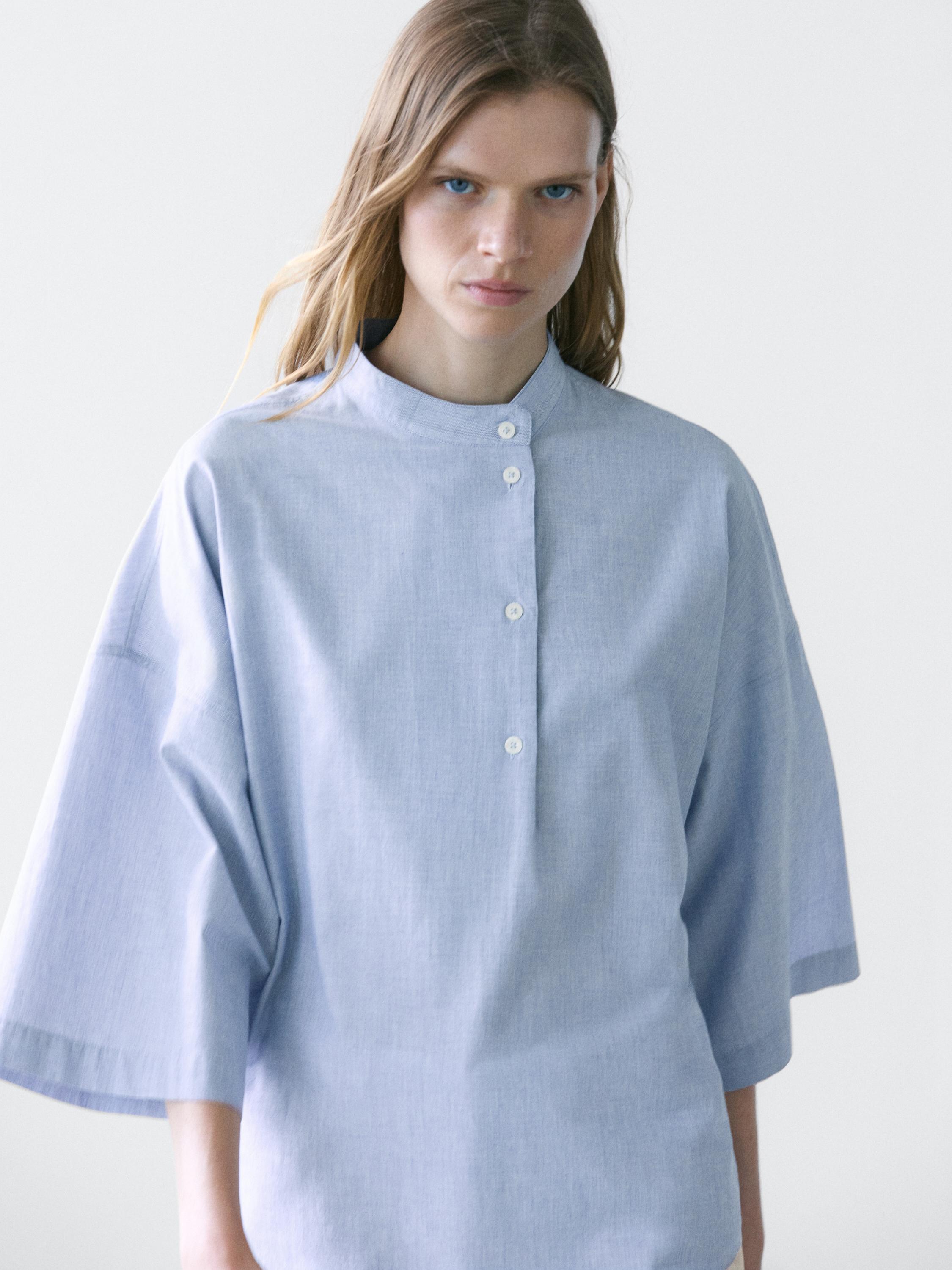 Flowing blouse with buttoned collar detail — Denim blue