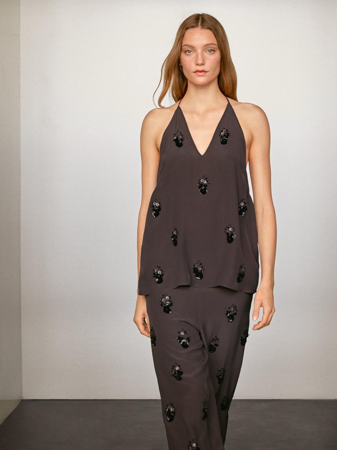 Pantalon fluide à fleurs appliquées