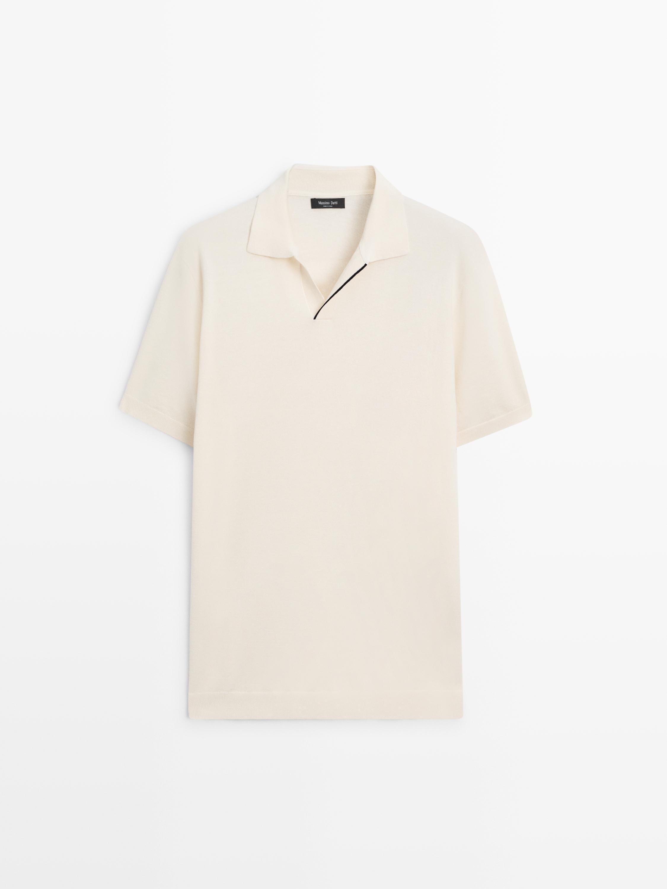Front view of a raw short-sleeved polo shirt with an open collar and a black line detail on the neckline.